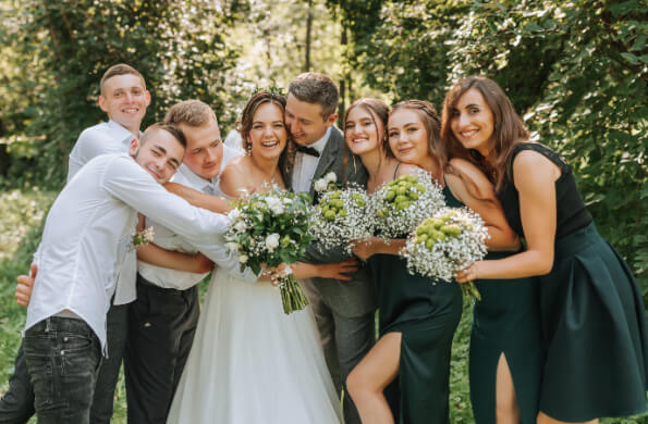 A couple hugging their wedding party